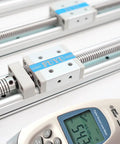 Close-up of Tiny But Mighty Mini Linear Motion Guide Actuator with 200mm Stroke Aluminum Linear Rail Ball Screw and measuring tool.