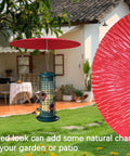 13 Inch Metal Bird Feeder Baffle Rain Guard shielding a feeder from rain, wind, and sun under a garden setting.