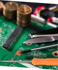 Close-up of 7 Piece Soldering Repair Tool Kit with desoldering tools on a circuit board, showcasing soldering aids and tools.