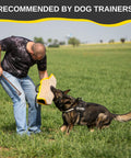 Trainer using Durable Dog Bite Sleeve For Medium To Large Breeds Pro Training Gear For German Shepherds And Pitbulls Safe Padded Arm Sleeve for K9 training outdoors.