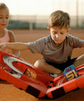 Children exploring the Speed Arena Disney Pixar Cars Slot Car Race Track Set With Lightning McQueen And Dinoco Cruz Ramirez.