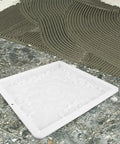 Heavy Duty Reusable Concrete Molds For Walkways And Patios Large Plastic Square Paver Molds For DIY Cement Stamps And Flagstone Forms Create Garden Paths And Patio Stones 15.7 X 15.7 X 1.4 Inches showing a top view on concrete surface