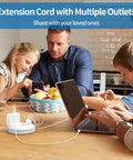 Family using Must Have Travel Power Strip With Three Outlets And Three USB Ports Including One USB C Cruise Approved Short Three Foot Extension Cord For Hotels Cruises Home Or Office Compact White at dining table.