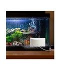 Indoor Window Mount Outdoor Security Camera with strong suction cup attached to a fish tank.