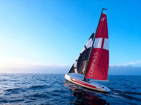 53 Inch Remote Control Sailboat Kit With Pre Assembled Sail Accessories sailing on open water at sunset