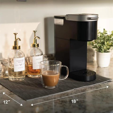 Absorbent Coffee Mat For Countertops 12 By 18 Inch Spill Catcher Pad under coffee maker with syrups and cup.