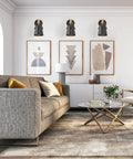 Living room with set of two modern wall sconces with E26 base, wood and leather look, above sofa, soft glow lighting.