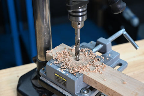 Seven Sixteenth Inch HSS Brad Point Drill Bit for Wood precision drilling clean splinter-free hole in wood block on drill press