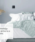 Smart Thermostat T5 Black ENERGY STAR Certified on bedroom wall with comforter, promoting geo-fencing and easy temperature control.