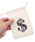 Person holding beige cotton drawstring pouch with money sign, 10x15cm, from Beige Cotton Drawstring Gift Pouches With Money Sign For Cowboy Party Decor And Birthday Party Favors, 10x15cm, Multipurpose Storage Bags, 24 Pack For Easy Gifting.