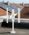 Three Blade Vertical Axis Wind Turbine Kit With 12V 40W 3-Phase Permanent Magnet Motor on rooftop.
