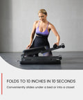 Woman folding the Versatile 5 In 1 Adjustable Weight Bench For Home Gym With Foldable Design And 800 Pound Capacity Ideal For Dumbbell Sets Incline Decline Flat And Upright Positions For Full Body Strength Training And Bench Press