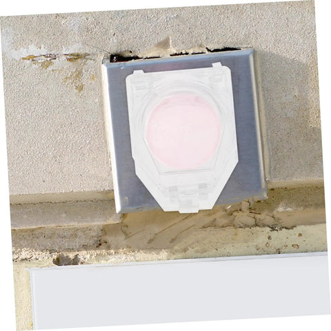 Two Pack Emergency Stop Button Cover Guards For Machines installed on concrete wall, clear protective shield visible over button.
