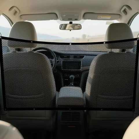 Heavy Duty Mesh Pet Gate For Tesla Cybertruck locks down rear space with a view of the driver area and mesh divider.