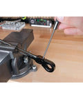 Using 8 Inch Long Pin Punch Set 5 Piece Carbon Steel With Knurled Handles For Deep Pin Removal In Obstructed Areas Includes 1/8 Inch 3/16 Inch 1/4 Inch 5/16 Inch And 3/8 Inch Pins Wall Mountable And Easy To Use on metal workpiece in vise