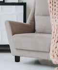 Four Pack Round Plastic And Metal Furniture Feet With Screws For Sofas, Chairs, And Cabinets, visible on beige sofa leg