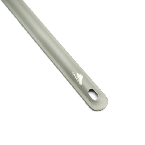 Ultra Lightweight Titanium Long Handle Spork With Polished Bowl For Camping And Hiking end view showing logo detail