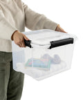 Person holding a clear 34 quart gasket storage box with lid, showcasing blanket, book, and supplies inside.