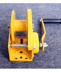 Heavy Duty Electric Hoist 2600 LB Manual Winch Hand Crank Self-Cranking Lifter with yellow steel body and handle for garage use.