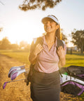 Smiling woman carrying All In One Women Golf Club Set With Driver Fairway Wood Hybrid 6 PW Irons Putter Stand Bag 3 Head Covers