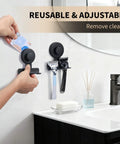 Two Matte Black Shower Razor Holders With Heavy Duty Suction Cups and Razors Mounted on Bathroom Wall Near a Mirror and Sink