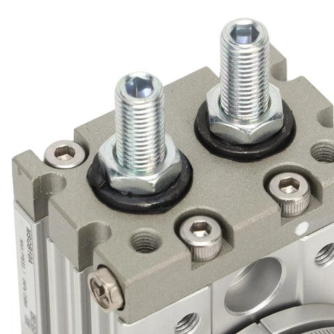 Close-up view of MSQB-10A pneumatic rotary actuator showing two threaded shafts and gray aluminum body.