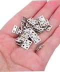 Lil Copper Miniature Hinges With Screws Pack Of 100 For Dollhouses And Tiny Boxes 10x8mm Silver Finish Hinges displayed on a hand