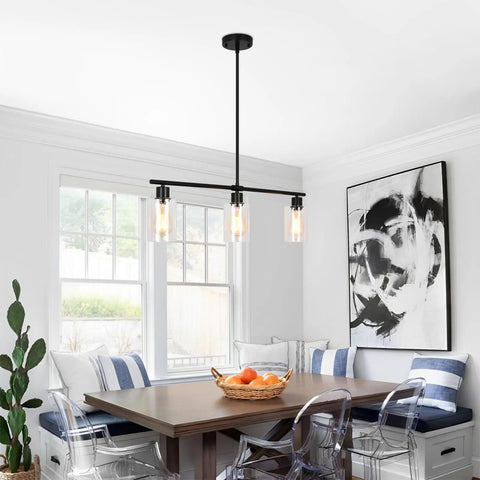 Three Light Black Pendant Lights For Kitchen Island With Glass Shades And Adjustable Rods Hanging Linear Chandelier Perfect For Modern Dining Room Over Table Industrial Vibe Home Lighting To Brighten Up Everyday Kitchen Tasks installed over a dining table.