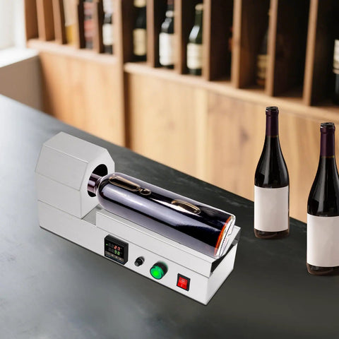 Plug And Play Electric Pvc Bottle Cap Heat Shrinker 110V Tabletop Sealer on countertop with two wine bottles.