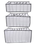 Total Closet Game Changer 3 Pack Seven Grid Foldable Bins With Grippy Handles in white fabric for organizing socks and pants.