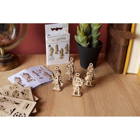 Hogwarts Student U Fidgets Four Pack Magical Themed Fidget Toys For Stress Relief Desk Toys Brain Breaks And Collectors Perfect Gift For Harry Potter Fans And STEM Play Lovers wooden figures on desk