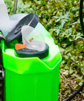 Electric Sprayer Nozzles Kit with Transparent Windproof Shield Drift Guard on green sprayer in garden
