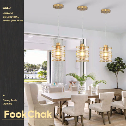 Gold Pendant Light Set Of 3 With Spiral Cage And Seeded Glass Shades for Kitchen Island in dining room setting