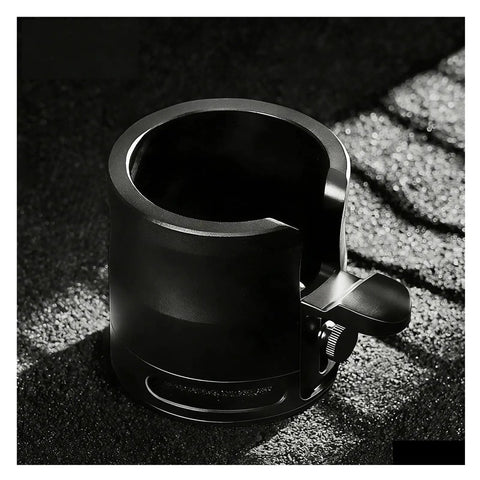 Perfect Your Daily Grind With This Top Shelf Height Adjustable Coffee Tamping Station Built For 58mm Portafilters And Equipped With A Thick Silicone Base, close-up of black tamping station.