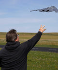 Person launching Spirit Of America Twin 30mm EDF RC Warbird Micro Airplane BNF Basic With SAFE Select outdoors