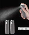 Close-up of On The Go Screen Cleaning Kit With Spray showing hand using fine spray bottle, two additional bottles in view.