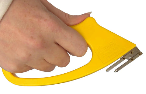 Close-up of a hand using the Slick Dual Purpose Flute Cutter For 4Mm Coroplast And Corrugated Plastic Panels.
