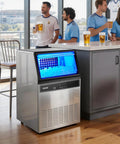 Top Notch Commercial Ice Maker Cranking Out 120 Lbs Daily With Slick Under Counter Design, Built In Self Cleaning, And Rugged Stainless Steel Shell in kitchen setting.