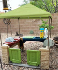All Around Playtime Patio Canopy Replacement For Outdoor Play Kitchen Playset in green providing shade for kids' playhouse