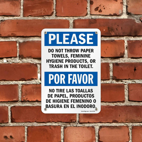 Please Do Not Flush Paper Towels Or Trash In The Toilet Bilingual Sign 7x10 Plastic Built Tough HDPE Outdoor Ready Heavy Duty 55 Mil Construction Weather Resistant For Indoor Or Outdoor Use With Rounded Corners And Recyclable Base. bilingual restroom sign on brick wall