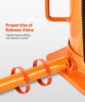 Orange metal air-hydraulic bottle jack with manual handle; close-up view of lifting rod and base.
