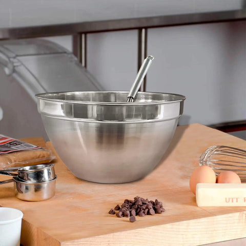 V Shaped Stainless Steel Mixing Bowl, 3 Quart Capacity on a kitchen counter with measuring cups and eggs
