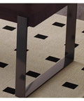 Close-up of Top Shelf Standing Desk With Sleek Smoky Matte Paint Boss Ready Computer Workstation stainless legs on a patterned rug.