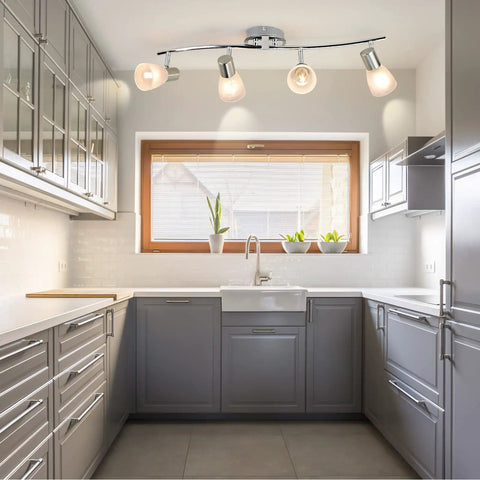 4-Light Foldable Track Lighting With Glass Shades, S Shaped Ceiling Fixture in gray modern kitchen, adjustable arms visible