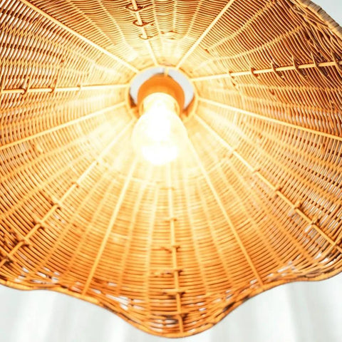 YUJIDAO 19.7 Inch Rattan Chandelier, Boho Pendant Lighting, close-up view of hand-woven shade and light bulb.