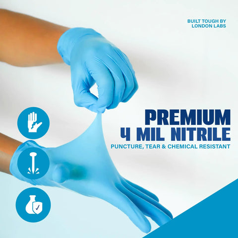 Person pulling a Blue Nitrile Exam Gloves 4 Mil Heavy Duty, showcasing chemical resistance and tough grip.