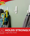 Large Utility Hook Mega Pack 14 Count for No Fuss Damage Free Hanging holds coats and bags on painted wall.
