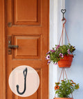 Dope Black Cast Iron Heart Shaped Wall Hooks For Home Decor Vibes And Closet Organization Heavy Duty Decorative Craft Hanging Hardware Reliable Set Of Two Pieces, holding a flower pot.