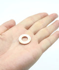 Go-To Flat Copper Sealing Washers 50 Pack M10 By 20 By 2mm Non Magnetic Conductive Corrosion Resistant Flat Ring Gaskets shown in hand