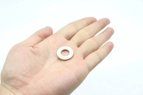 Go-To Flat Copper Sealing Washers 50 Pack M10 By 20 By 2mm Non Magnetic Conductive Corrosion Resistant Flat Ring Gaskets shown in hand
